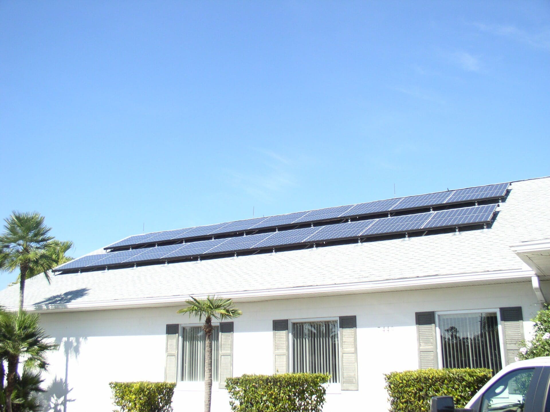 A building with solar panels on the roof.